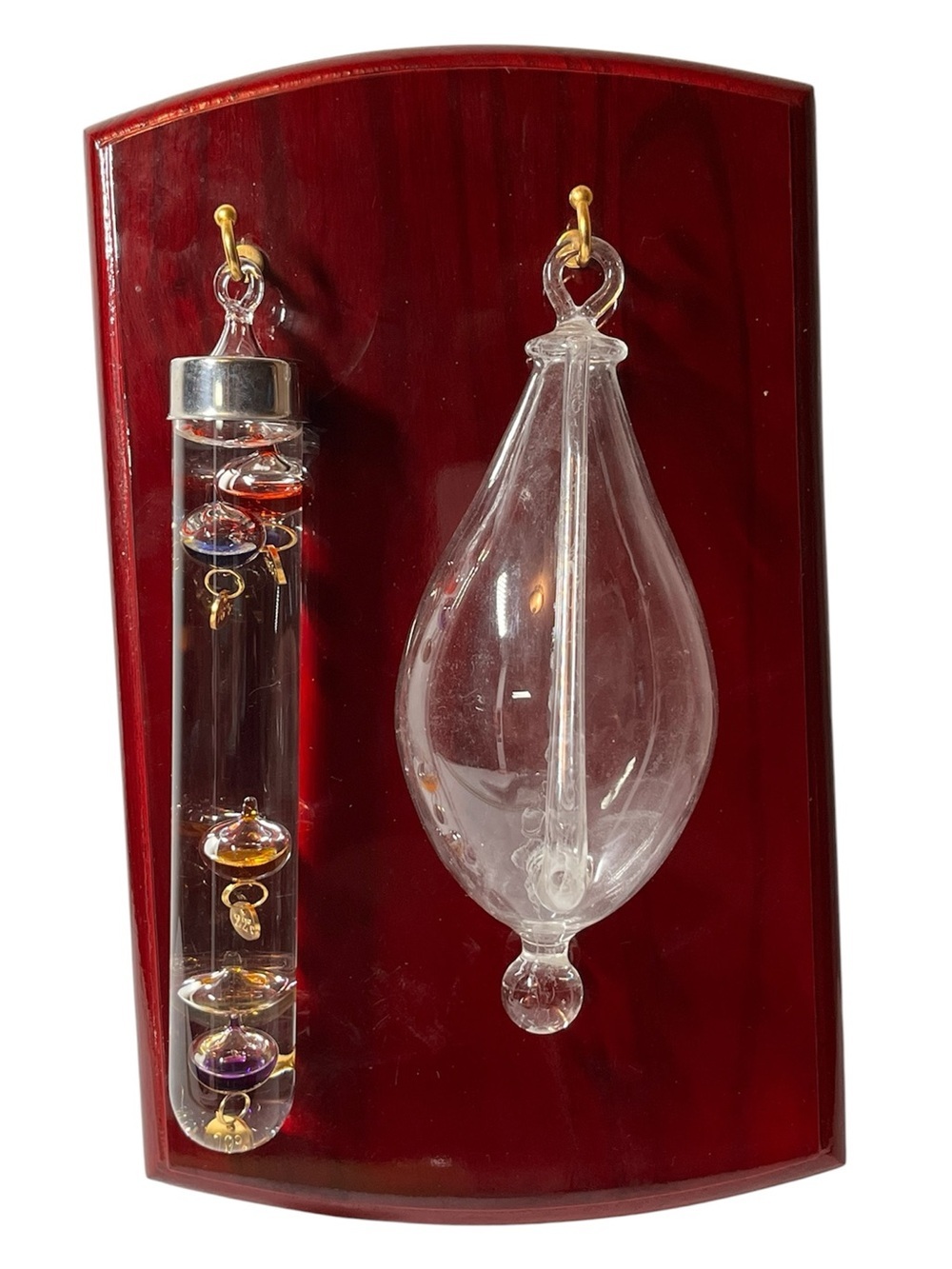 Maritime weather station 
Galilean thermometer & teardrop storm glass on wood